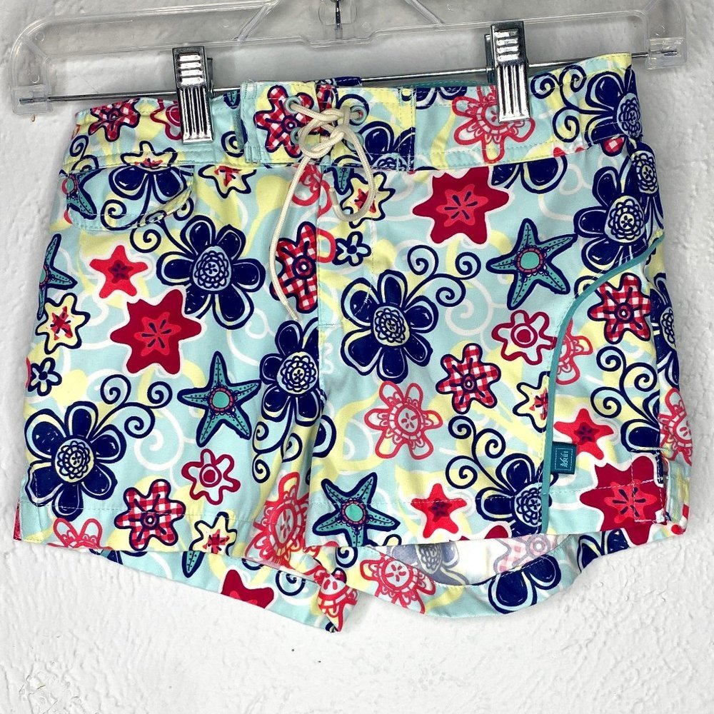 REI girl's size XS 6/7 floral board shorts with UPF 50+  sun protection.